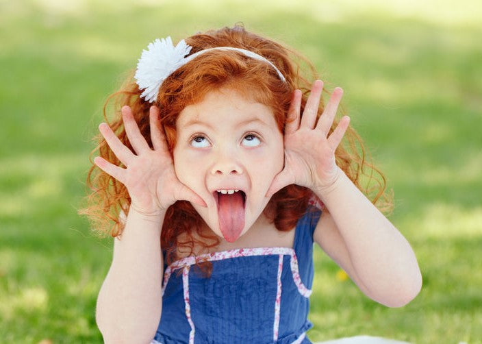 Girl making a funny face with her tongue out