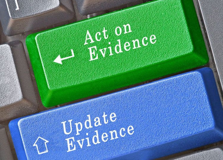 Keyboard keys labeled Act on Evidence and Update Evidence