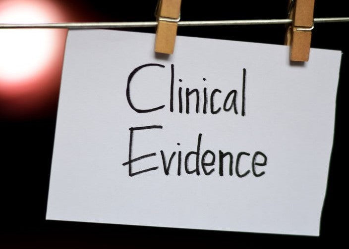 Clinical Evidence note clipped to a board