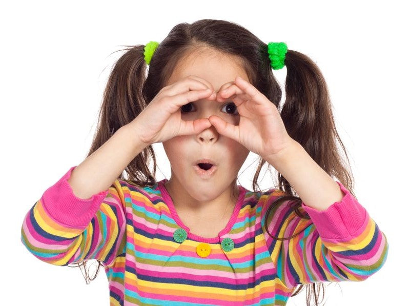 Girl making binoculars with her hands