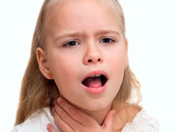 Girl touching her throat with her mouth open