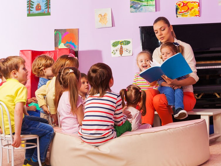 Teacher reading to a group of children