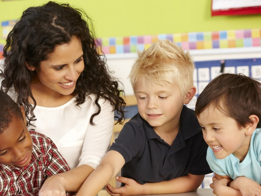 Teacher reading with young children