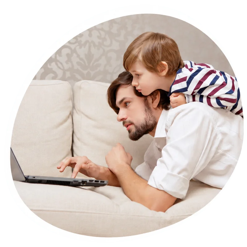 Father and child using a laptop together